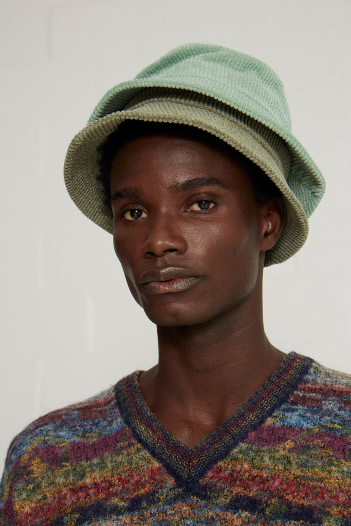 man in green vintage bucket hat cape town